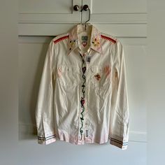 New With Tags Lucky Brand Embroidered Boho Button-Up Shirt With A Light Fade At Hemline. So Many Details And So Crisp And Clean For Any Occasion. Size Small White Embroidered Button-up Shirt, Multicolor Embroidered Button-up Top, Fitted Cotton Shirt With Multicolor Embroidery, Multicolor Embroidered Cotton Button-up Top, Embroidered Cotton Button-up Shirt, Cotton Tops With Multicolor Embroidery And Button Closure, Cotton Button-up Shirt With Floral Embroidery, Floral Embroidered Cotton Button-up Shirt, Button Shirt Women