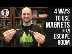 a man is holding up a black forest t - shirt with the words 4 ways to use magnets in an escape room