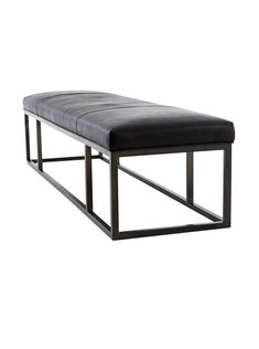 a black bench with metal legs and a leather seat cushion on it's back