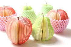 an image of three apples made out of paper