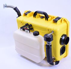 a yellow and white container with two black hoses on it's side, attached to a water pump