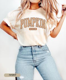 ⬇️ 》PLEASE READ TERMS BEFORE PURCHASE《 ⬇️ Embrace the cozy vibes of autumn with our Pumpkin Season T-Shirt! This eye-catching shirt features bold, retro-inspired checkered lettering that screams fall fun. Perfect for pumpkin patch visits, hayrides, or sipping your favorite pumpkin spice latte. Soft, warm, and brimming with autumn spirit - it's the ideal blend of comfort and style for those crisp fall days. A must-have for anyone who lives for pumpkin season and wants to show it off in vintage-in Fall College Graphic Print Tops, Fall Graphic Print College Top, Trendy Halloween Tops For Loungewear, Trendy Halloween Loungewear Tops, Trendy Fall College T-shirt, Fall School Spirit Relaxed Fit Tops, School Spirit Fall Tops With Letter Print, Trendy College T-shirt For Fall, Fall School Spirit Tops With Letter Print