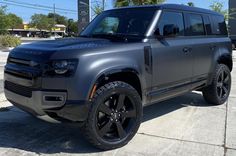 an suv is parked on the side of the road