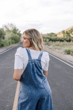 Indulge in effortless style with our May Chambray Denim Overalls. Crafted from luxurious 100% cotton, these overalls feature wide legs, hip pockets, and adjustable straps for a perfect fit. Lightweight and versatile, they are your go-to piece for a chic and comfortable look. Elevate your wardrobe with these must-have overalls. 100 Cotton Model Measurements: Hips 40” Waist 28” Bust: 34”, Height 5’7, wearing a size small Measurements S: Waist from top of pockets 40” | Inseam 26” | Length from top Bridesmaid Tops, Blessing Dress, Temple Dress, Boho Style Dresses, Denim Overalls, Wide Legs, Man Swimming, Romper Pants, New Arrival Dress