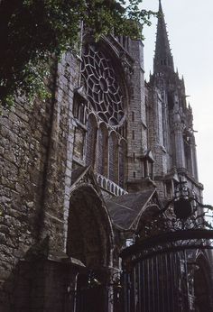 an old building with a gate in front of it