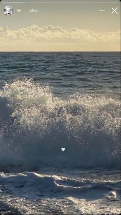 a man riding a wave on top of a surfboard in the ocean at sunset