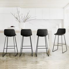 Bring the sophisticated look of leather seating to the bar or kitchen island with our faux leather counter stools. Pairing contemporary and industrial appeal, this design lends style with its simple seat and clean lines. The faux leather is soft to the touch, while the curved seating provides comfort. This set includes four Bar Stools made with faux leather upholstery and metal legs with a black finish for a sturdy piece . Drinking and talking with some friends, in the comfort of these mid-centu Black Bar Chairs, Black Kitchen Stools, Black Bar Stools Kitchen Island, Black Bar Stools Kitchen, Updated Apartment, Kitchen Island Bar Stools, Black Barstool, Island Barstools, Chairs For Kitchen Island