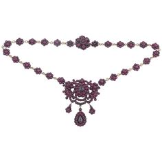 Victorian bohemian garnet necklace. This piece is set in silver gilt with pretty garnet flowers and smaller drop flowers. Circa 1870-80, Measures: 42cm long and the central drop measures 6cm Follow on instagram @bernardoantichita Bridgerton Diy, Silver Gold Necklace, Drop Necklaces, Silver Drop Necklace, Hattie Carnegie, Victorian Necklace, Jewelry Victorian, Miss Marple, Garnet And Gold