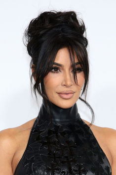 Kim Kardashian attended the 2023 CFDA Fashion Awards wearing a black Chrome Hearts gown. Hairstyles Kim Kardashian, Kim K Hairstyle, 90s Hair Up Styles, Edgy Hair Updo, Hair Pin Up Styles, Messy High Bun Updo, Updo With Tendrils, Kim Kardashian Hairstyles 2023, Kim Hairstyles Kardashian