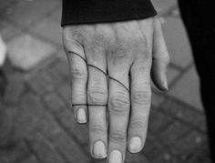 a black and white photo of a person's hand