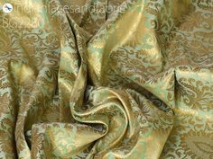 an image of a gold and green fabric