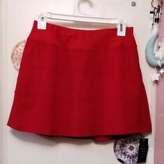 Drawstring Adjuster Inside Waistband Key Pocket Small Zipper Pocket Tiered Finish Skirt Over Shorts Combo Red Cotton Lined Skirt, Red Skort With Built-in Shorts, Red Short Skort With Built-in Shorts, Red Stretch Short Skirt, Red Stretch Skirt With Short Length, Stretch Red Mini Bottoms, Red Summer Skort With Built-in Shorts, Red Stretch Mini Bottoms, Red Stretch Mini Length Bottoms