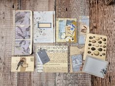 an assortment of papers, buttons and other items on top of a wooden table with writing