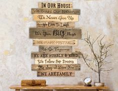 a wooden sign that says in our house we are family