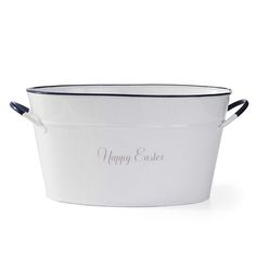 a white metal tub with the words happy easter written in silver lettering on it and black handles