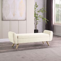 a white bench sitting on top of a carpeted floor next to a plant in a vase