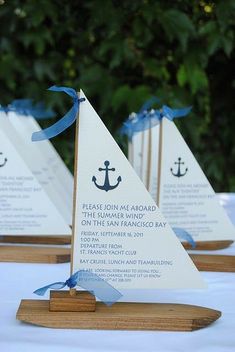 an image of a sailboat on the table with blue ribbon and text that reads, i've been working in the shipyard all the live long day