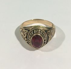 Hi, Here we have a beautiful 14k yellow gold east meadow 2001 Markella high school ring. Weigth: 7.5g. Width: 13.5mm. The perfect gift for your loved one. Comes with a free gift box. Ring is pre owned and will show normal wear but in excellent condition. Main Stone Color:Red Main Stone Shape:Oval Main Stone:Ruby Ring Size:8.5 Ring Shape:Oval Occasion:Graduation Sizable:Yes Main Stone Creation:Lab-Created Classic Engraved Ring Stamped 14k For Commemoration, Oval 14k Gold Signet Ring For Commemoration, 14k Gold Oval Signet Ring For Commemoration, Classic 14k Gold Engraved Ring For Commemoration, Classic Oval Engraved Ring For Commemoration, Heirloom Oval Ring For Commemoration, Heirloom 14k Gold Engraved Ring For Commemoration, Oval 14k Gold Commemorative Rings, Classic 14k Gold Birthstone Ring Collectible