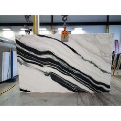 white and black marble is being worked on