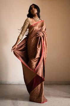 Burgundy saree with all-over jaal woven motifs and molten gold and copper borders. Comes with unstitched blouse fabric.
Component: 2
Pattern: Woven
Type Of Work: Thread
Fabric: Silk Brocade Banarasi
Color: Maroon
Other Details: 
Note: The blouse worn by the model is not for sale
Occasion: Wedding - Aza Fashions Aesthetic Sarees, Graduation Saree, Copper Saree, Copper Clothes, Baby Reception, Kajol Saree, Saree Drapes, Dusky Skin, Saree Styling