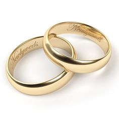 two gold wedding rings with names engraved on the sides, set against a white background