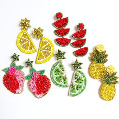 Add a touch of fruity fun to your summer adventures with our hand-beaded fruit earrings! Whether you're lounging by the pool or sipping tropical drinks on a sunny beach, these earrings are the perfect accessory to embrace the vibrant spirit of summer. The colorful fruit designs, including pineapples, strawberries, lemons, limes, and watermelons, will effortlessly complement any breezy summer outfits. Embrace the summer vibes and make a statement with our delightful fruit earrings this vacation s Beaded Fruit, Earrings Strawberry, Watermelon Earrings, Fruit Designs, Tropical Drinks, Strawberry Earrings, Custom Gift Cards, Pineapple Earrings, Fruit Earrings