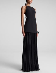 A.L.C. Lana Pleated Maxi Dress in Black on pre-order. Delivery date: 8/30/2024-9/30/2024. Maxi length. Sleeveless. Halter neckline. Dropped waist. Structured upper. Pleated jersey cady fabric skirt. Concealed back zipper closure. Fully lined. 100% Polyester, Contrast: 70% Triacetate 30% Polyester, Lining: 100% Polyester Dry Clean Length: 54.5" Model is 5'9.5" Wearing Size 4. Model Measurements: Bust 30.5" Waist 23" Hips 34". Elegant Pleated Sleeveless Dress For Evening, Evening Halter Neck Maxi Dress With Pleated Back, Evening Pre-draped Sleeveless Maxi Dress, Formal Halter Neck Maxi Dress With Pleated Back, Black Pleated Sleeveless Evening Dress, Chic Black Maxi Dress With Pleated Bodice, Black Evening Dress With Pleated Back, Evening Pleated Maxi Sleeveless Dress, Black Pleated Back Maxi Dress For Evening