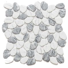 white and grey pebbles are arranged on the floor