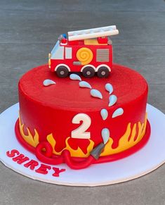 a birthday cake with a fire truck on top