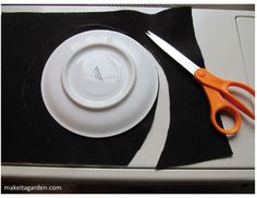 a pair of scissors sitting on top of a white plate