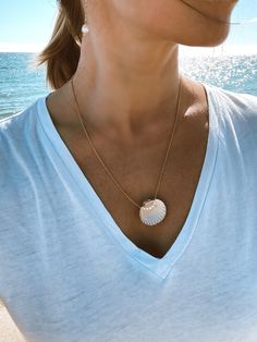 Great summer accessory for ocean lovers! Made of the real shell found on the beaches of Marbella in Spain. Decorated with natural mini pearls. Chain is gold plated 925 silver. Measures 60 cm. Handmade in Spain. Beach Pearl Chain Shell Necklace, Summer Gold Pearl Necklace With Pendant, White Delicate Chain Necklace For Beach, Gold Necklace With Pearl Pendant For Summer, Summer Shell Necklace With Pearl Charm, Summer White Necklace With Pearl Pendant, Summer White Necklaces With Pearl Pendant, White Pearl Necklace With Pearl Pendant For Beach, Summer White Pearl Pendant Necklace