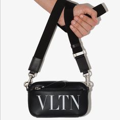 Either If You're Strolling Across Town Or Visiting A New One, Valentino Garavani Will Keep You Company. In The Shape Of This Leather Crossbody Bag, That Is. Time To Choose Your Plans. Highlights - Black Leather " Logo Print To The Front Silver-Tone Hardware - Top Zip Fastening Adjustable Neck Strap Main Compartment - Front Zip-Fastening Compartment Valentino Crossbody Bag, Valentino Crossbody, Valentino Garavani Bag, Crossbody Bag Black, Valentino Bags, Leather Messenger Bag, Mini Crossbody Bag, Studded Leather, Small Tote