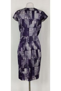 This pretty dress has a fun abstract print in a chic purple and white color. Cap sleeves, a plunging neckline and pleats along the waist all elevate this basic dress from Poleci. It can be dressed up or down for any occasion. Size 4 91% silk, 9% lycra V-neck Cap sleeves Side zipper Unlined Abstract print Bust 34.5" Waist 30" Shoulder to hem 39" Fitted Purple Printed Dress, Fitted Purple Printed Midi Dress, Purple Lined Midi Length Dresses, Purple Fitted Dress With Pleated Bodice, Elegant Fitted Pleated Dress With Floral Print, Fitted Purple Pleated Midi Dress, Chic A-line Dress With Abstract Print, Casual Pleated Purple Dresses, Casual Purple Pleated Dresses