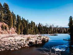 a river surrounded by trees and rocks