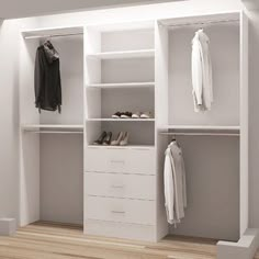 an empty white walk in closet with shoes and coats on the shelves next to it