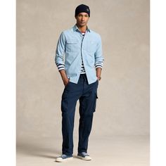 This lightweight shirt combines a rugged silhouette with indigo-dyed cotton chambray. Casual Cotton Shirt With Cargo Pockets, Dark Wash Cotton Shirt For Work, Casual Cotton Outerwear By Ralph Lauren, Indigo Cotton Top With Patch Pockets, Indigo Cotton Tops With Patch Pockets, Casual Indigo Shirt With Patch Pockets, Ralph Lauren Blue Relaxed Fit Shirt, Blue Relaxed Fit Ralph Lauren Shirt, Blue Cotton Utility Tops