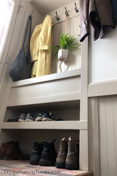 the shoes are lined up on the shelf next to the coat rack in the closet