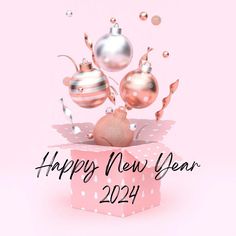 a pink box with christmas ornaments on it and the words happy new year