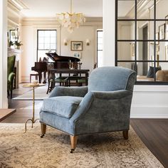 a living room filled with furniture and a large mirror