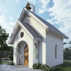 a small white church with a bell on it's steeple and stained glass windows