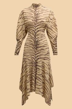 Description
Stella McCartney jersey midi dress in an allover tiger print featuring a dropped handkerchief hem 
High neckline
Long sleeves
Side slip pockets 
Hem falls below the knee
A-line silhouette 
Concealed back zip
Nylon/polyamide/elastane
Made in Italy Tiger Dresses, Chic Tiger Print Party Dress, Tiger Dress, Zebra Dress H&m, Jungle Boogie, Roberto Cavalli Tiger Dress, Handkerchief Hem, Tiger Print, High Neckline