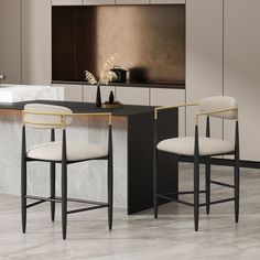 two black and white bar stools next to a counter