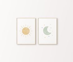 two framed art prints depicting the sun and moon in pastel colors on a white wall