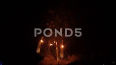 fireworks are lit up in the night sky with words pond5 on it's side