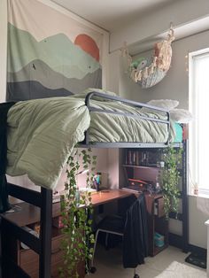 a bedroom with a bed, desk and hanging plants