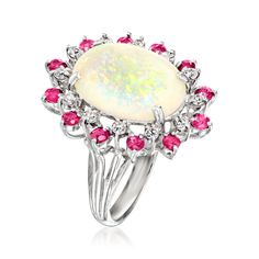 Ross-Simons - C. 1970 Vintage Opal, 1.20ct t. w. Ruby, 30ct t. w. Diamond Cocktail Ring Oval Cut Size 6.5. C. 1970. Elegant with the perfect dose of color, this Estate collection cocktail ring is the perfect piece for sprucing up old ensembles. Features a 16x12mm oval opal cabochon showing off its iridescent array of colors amid a sparkling halo of 1.20 ct. t. w. round rubies and .30 ct. t. w. round brilliant-cut diamonds. Crafted in 14kt white gold. 1" wide. Diamond, ruby and opal cocktail ring Platinum Ruby Ring With 17 Jewels, Classic White Oval Ruby Ring, Dazzling Multi-stone Platinum Jewelry, White Ruby Ring With Vvs Clarity, Platinum Multi-stone Cluster Ring, Formal Multi-stone Diamond Opal Ring, Formal Multi-stone Opal Ring With Diamonds, Fine Jewelry Multi-stone Diamond Ring, Multi-stone Cluster Platinum Jewelry