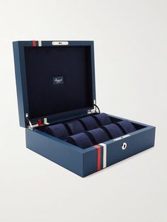 Your most prized timepieces deserve to be housed somewhere special. Offering space for up to eight watches, Rapport London's 'Greenwich' box is handcrafted from blue full-grain leather with red and white stripes that nod to the Union Jack. The plush suede interior and cushioned rolls keep every piece safe and secure. Rectangular Blue Watch Accessories For Gift, London Greenwich, Watch Box For Men, Leather Watch Roll, Mens Watch Box, Leather Watch Box, Watch Roll, Watch Winder, The Union