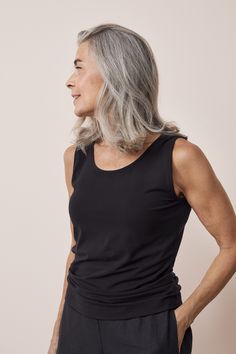 Women's black tight-fitting sleeveless top with a wide neckline. Material is a lightweight EcoVero jersey. Material is wonderfully luxurious, pleasantly cool against the skin and beautifully descends. Designed with love in Finland. Made with care in Lithuania.