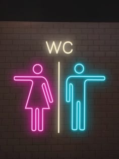 a neon sign that says we are in the bathroom