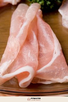 raw meat sitting on top of a wooden table